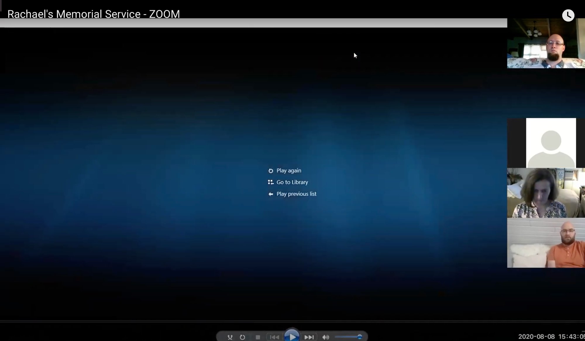 A blurred screenshot of a Zoom memorial service showing the end screen with playback options